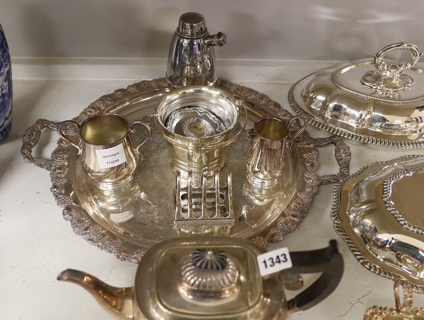 A large quantity of plated wares including two entree dishes and covers, a three-piece tea set etc.
